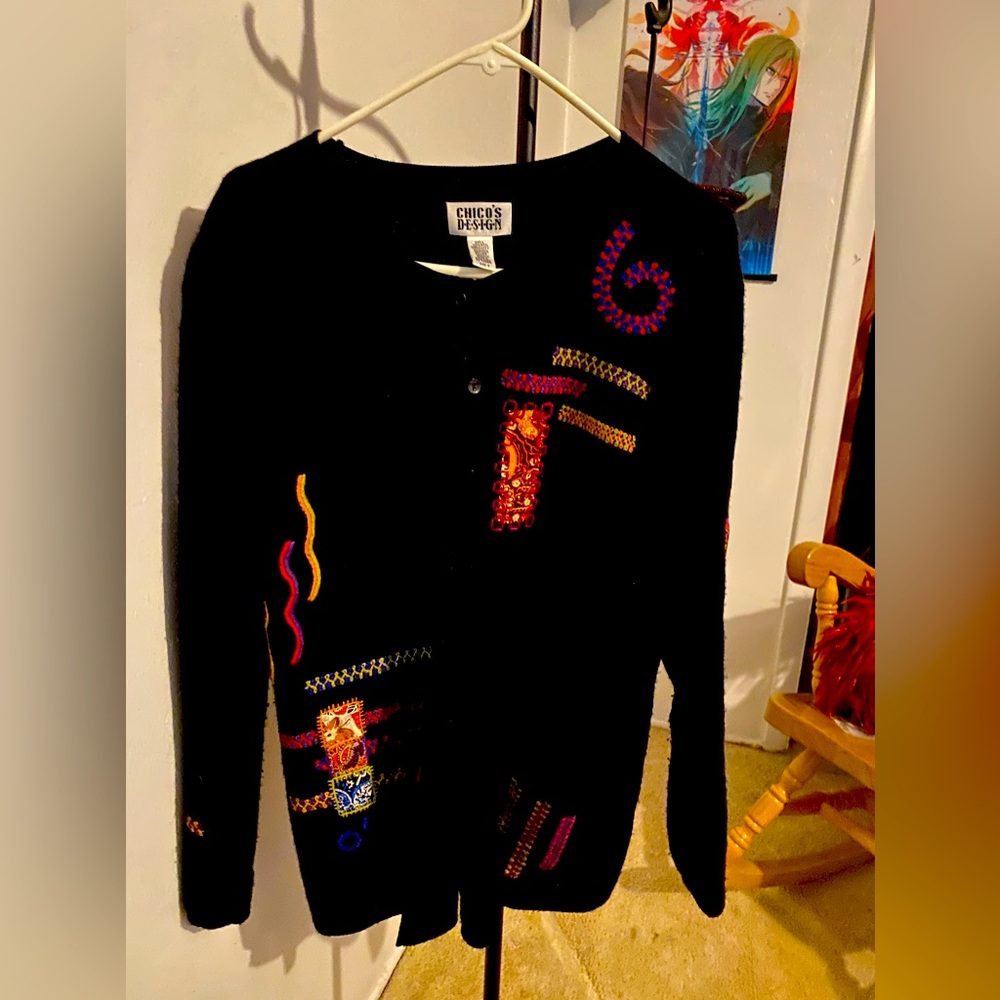 Chicos women’s sz 2 black wool w colored appliqués button up sweater.